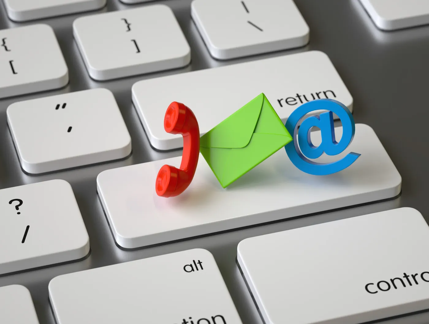 A keyboard with symbols representing telephone, email and electronic correspondence