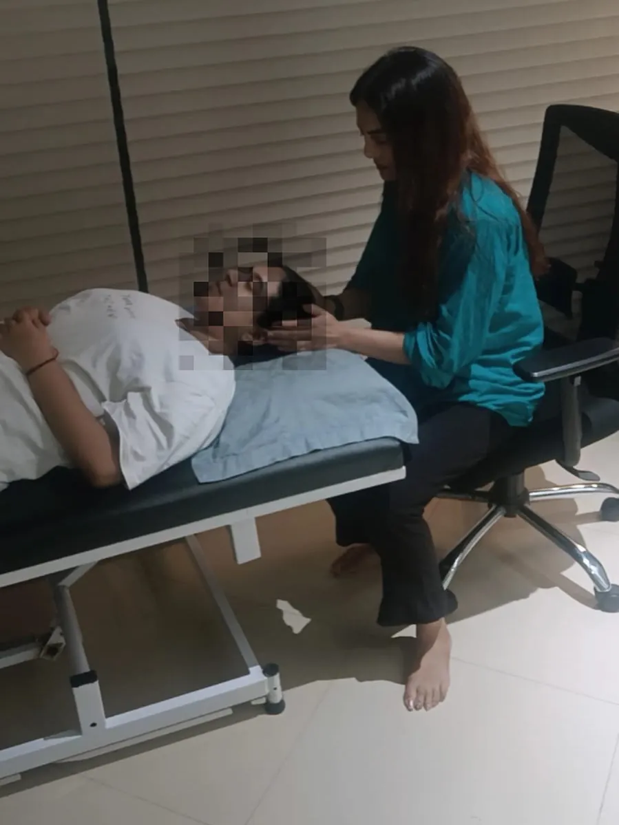 A calm, personalised hypnotherapy session in progress with the client resting comfortably; identity protected